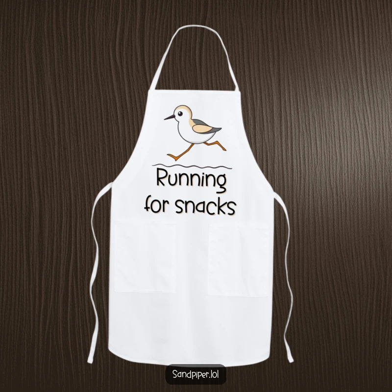 Funny apron showing a sandpiper with long legs running on a wavy line, perfect for beach-themed cooking.