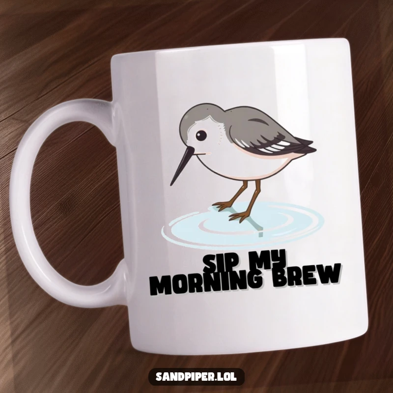 Funny Sandpiper Mug featuring a thirsty bird character dipping its beak into water, a humorous scene.