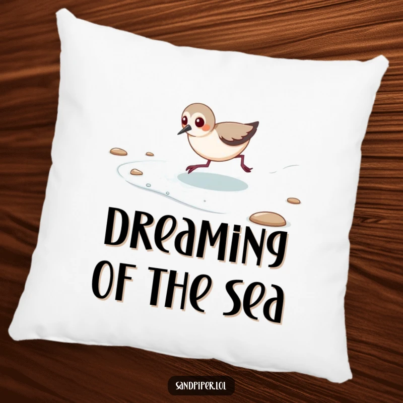 Funny pillow featuring a sandpiper playfully chasing the ocean's retreating tide.