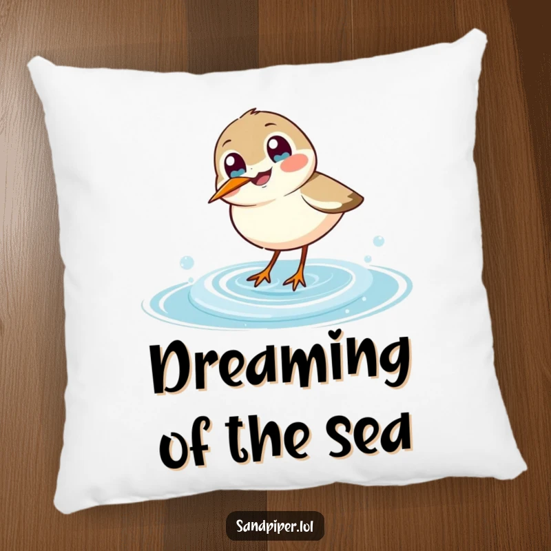 Funny sandpiper pillow, soft cushion with a joyful bird dipping beak into a wave, humorous home decor.
