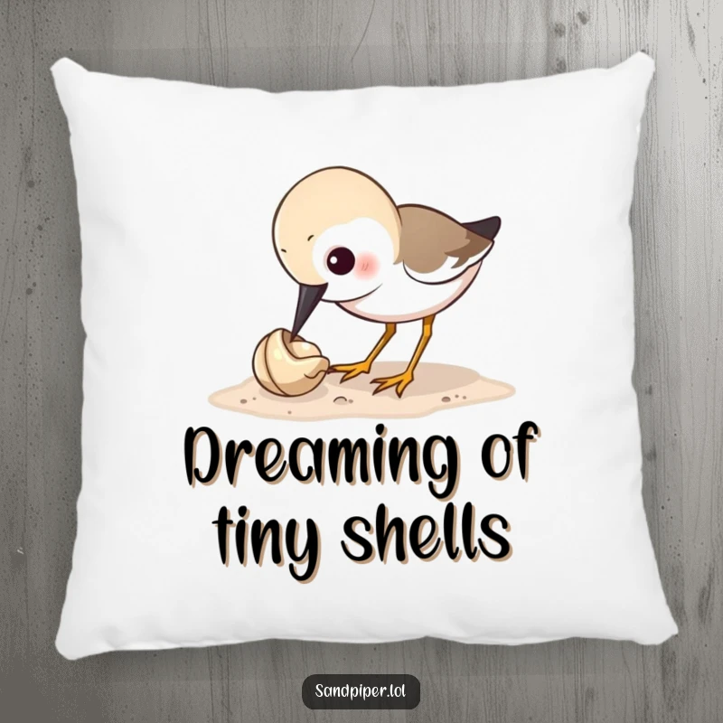 Funny sandpiper pillow showing a bird's comical fixation on pecking a tiny shell, bringing cozy humor to any room.