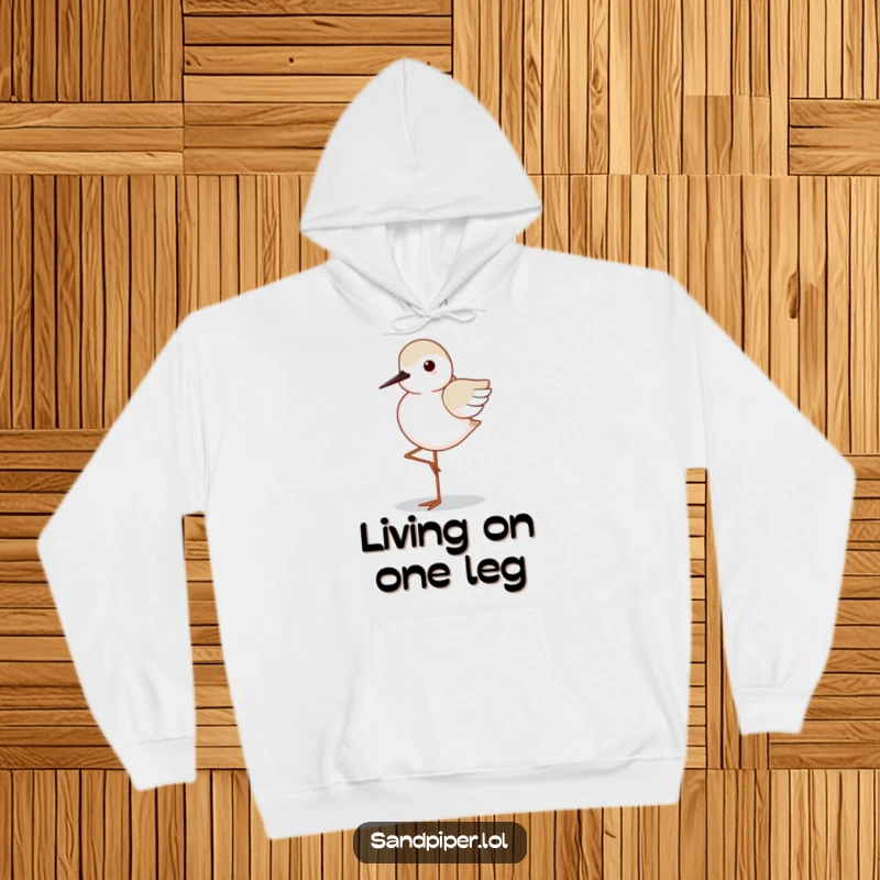 Funny Sandpiper Hoodie: A sandpiper stands on one leg, wings neatly tucked, conveying a humorous sense of calm and balance.