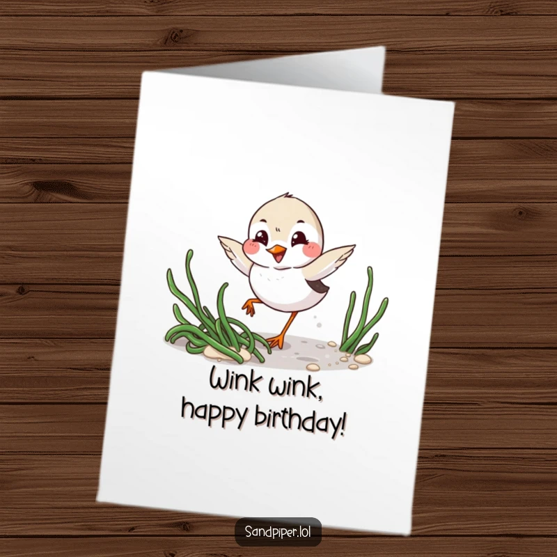 Funny free printable birthday card featuring a playful sandpiper winking mischievously while darting around seaweed, bringing beachy birthday cheer.