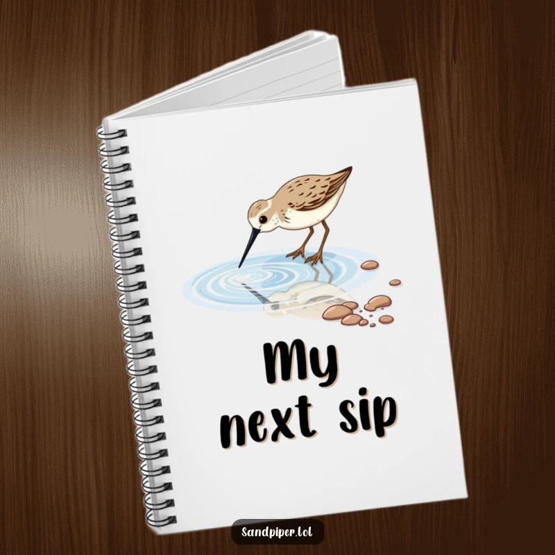Notebook featuring a sandpiper bird dipping its long beak into a sparkling tidal pool, perfect for journaling thoughts.