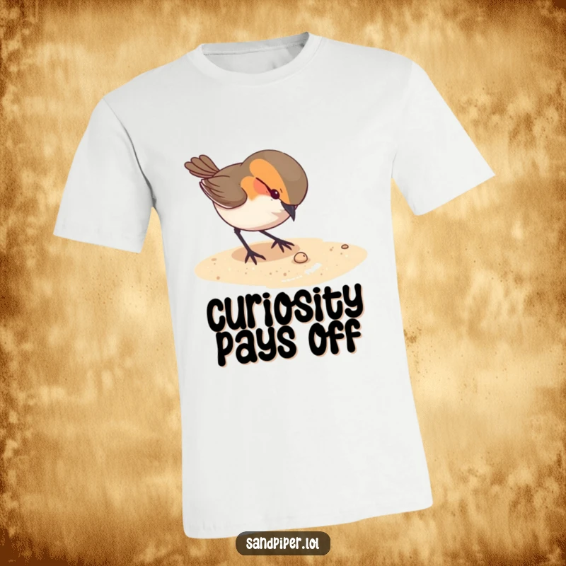 Funny t-shirt featuring a curious bird pecking intently at something tiny on a sandy ground, representing keen observation.