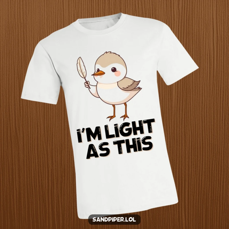 Funny T-Shirt: A sandpiper bird proudly presents a tiny feather, symbolizing appreciation for nature's delicate beauty.