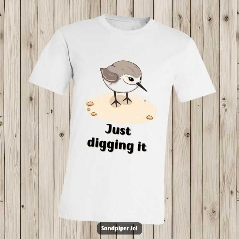 Funny sandpiper t-shirt, bird happily digging beak in wet sand, beach scene, humorous seaside apparel, ideal gift.