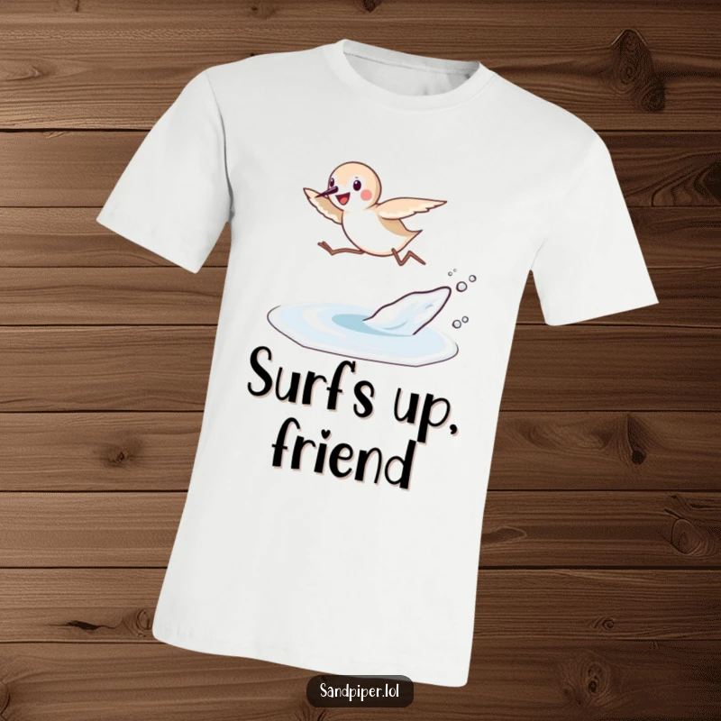 Funny Sandpiper Leap T-Shirt: A sandpiper bird joyfully leaps high over a small wave, capturing a moment of pure beach bliss.