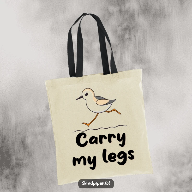 Funny tote bag showing a comical sandpiper with long legs running across a wavy line, perfect for beach trips.