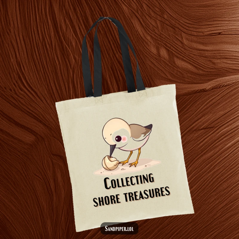 Funny sandpiper tote bag showing a bird's humorous obsession with pecking a tiny shell, a practical and amusing accessory.