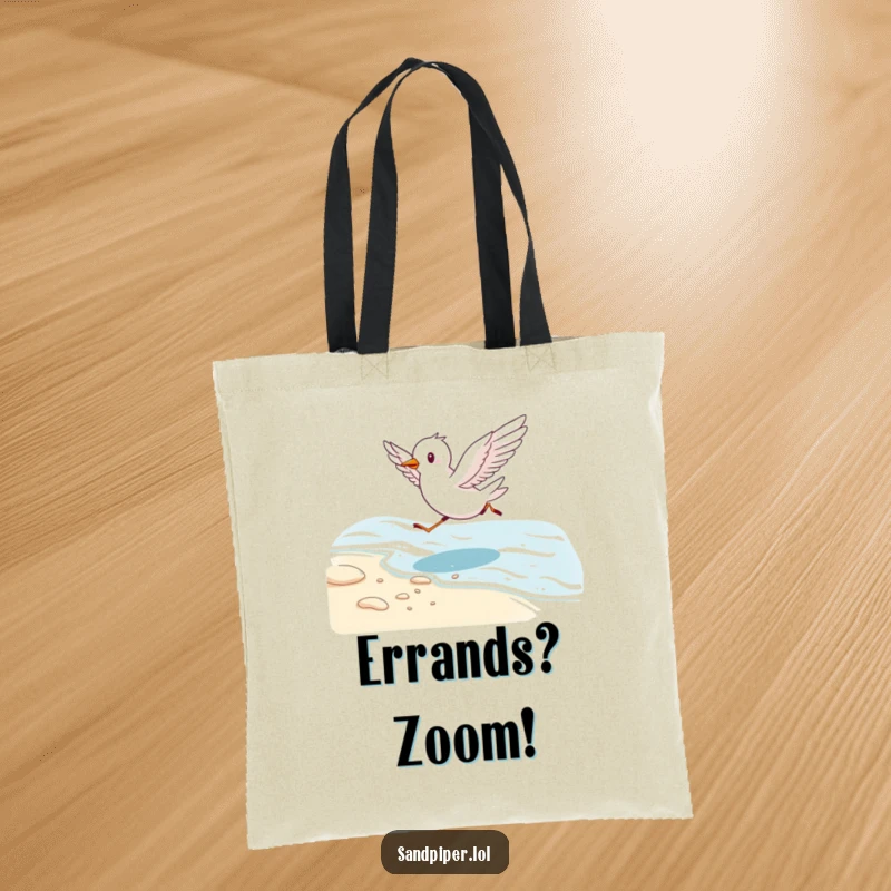 Funny tote bag featuring a cute bird running energetically along a shoreline with wings outstretched, perfect for beach essentials.