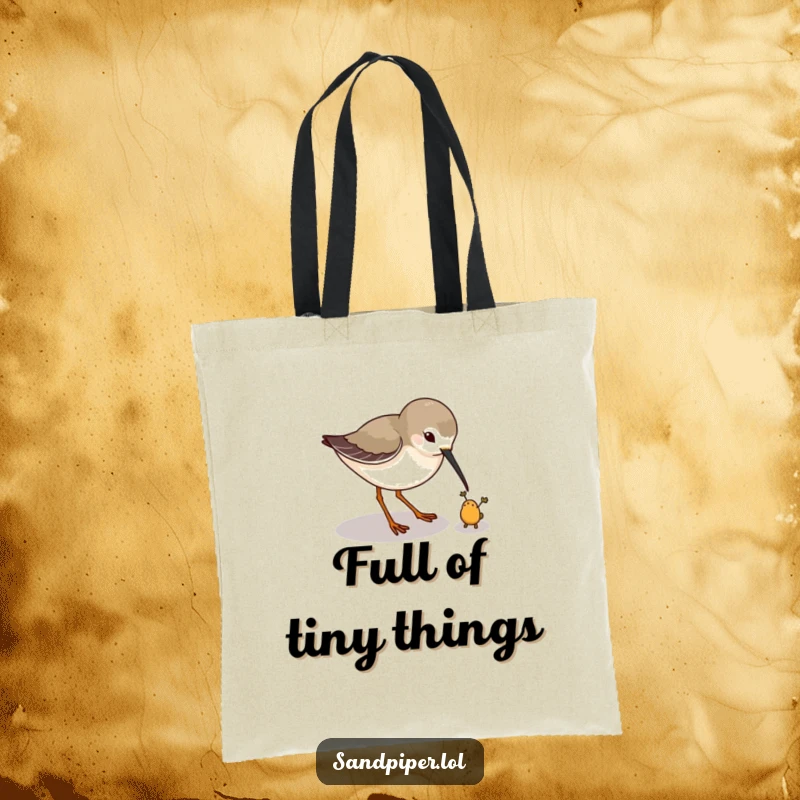 Funny tote bag with a sandpiper playfully pecking at a tiny imaginary bug, perfect for nature outings. A practical funny gift.