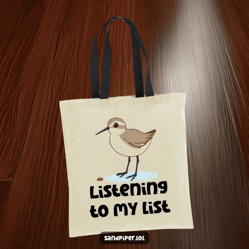 Funny tote bag with a sandpiper tilting its head, listening intently, perfect for carrying your keen thoughts. A practical funny gift.