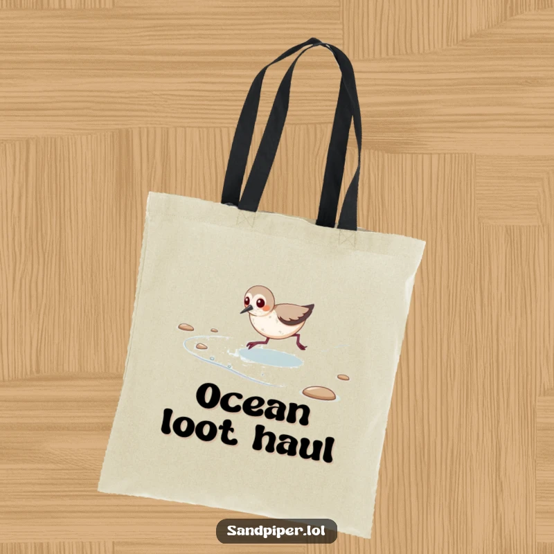 Funny tote bag showing a happy sandpiper playfully chasing the outgoing tide.