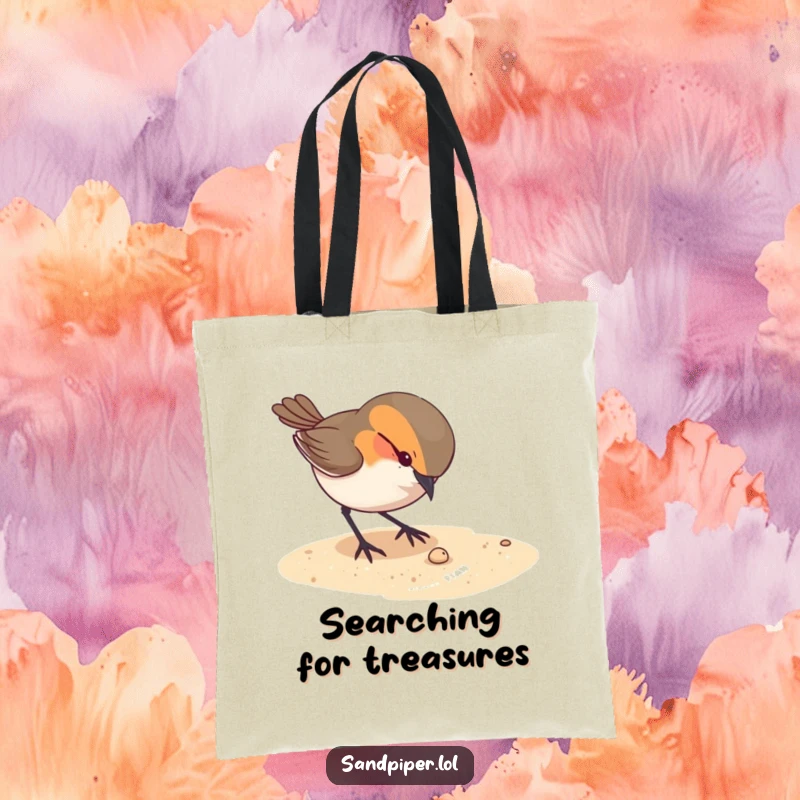 Funny tote bag featuring a curious bird pecking at something tiny on the sandy ground, perfect for carrying treasures.